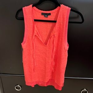 Sanctuary size small (fits lose like a medium) orange tank